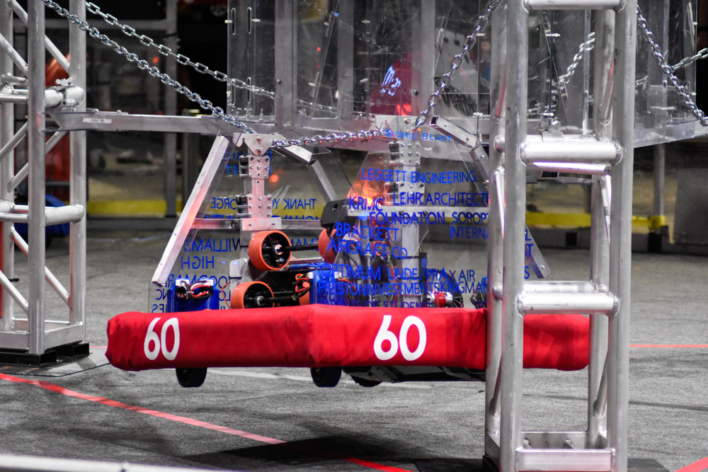 2024 robot scoring a ring into the goal
