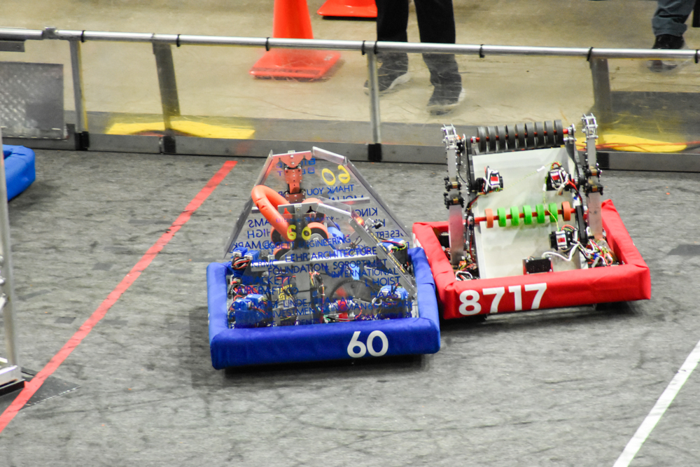 2024 robot scoring a ring into the goal